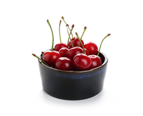 Many fresh ripe cherries in bowl isolated on white