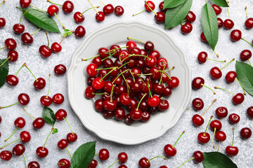 Fresh ripe cherries on light table, flat lay
