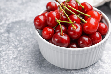 Fresh ripe cherries on light table, closeup