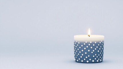 Lit Candle with Polka Dots on Blue Background