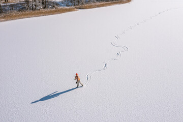 Girl Ice Skating on Frozen Lake