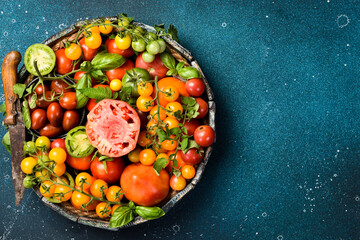 Organic food. Fresh tomatoes in a wooden box. Top view.