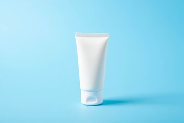 A template for advertising creams, lotions, shampoos, and toothpastes. a white cream tube with no labels on a gray background.