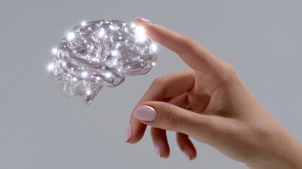 Human hand interacting with futuristic glowing brain model
