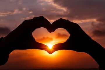 digital art selected for the #. two hands making a heart shape. a person taking a picture of a sunset