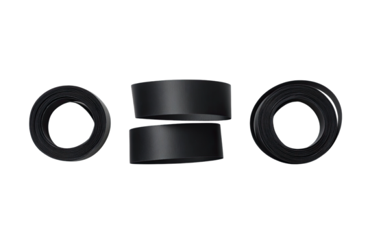 Three black tire-like objects, stacked and arranged