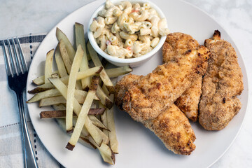 chicken tenders  with  fries and macaroni salad