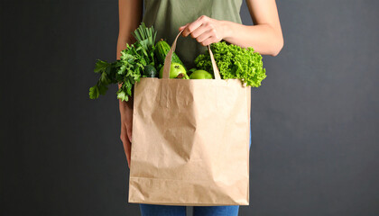 Fresh Green Grocery: A person holds a bag filled with fresh, organic produce, promoting healthy eating and sustainable living. Emphasizing freshness and conscious consumerism.