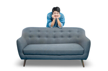 A young man with a cute, winking expression rests his chin on his hands while peeking over an empty...