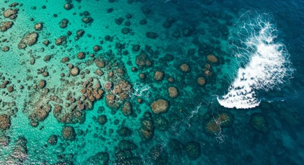Fototapeta premium Aerial View of Turquoise Ocean with Coral Reef and Waves