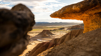 mountain with long shadows with frame of rocks