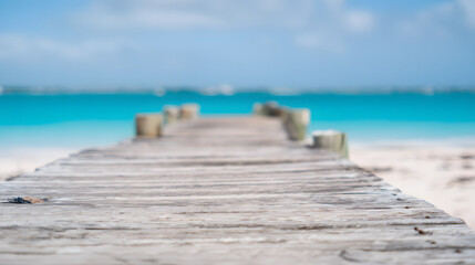 Wooden dock stretching into turquoise waters, serene beach backdrop. Tranquil escape into nature's beauty.