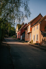 A row of houses with a street in between