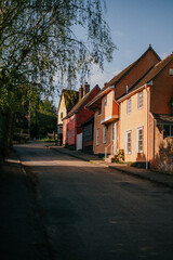 A row of houses with a street in between
