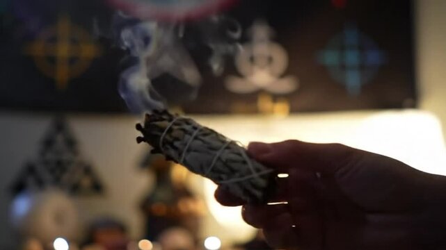 Smudge Stick of Sage Being Lit Slowly During Sacred Healing Ritual