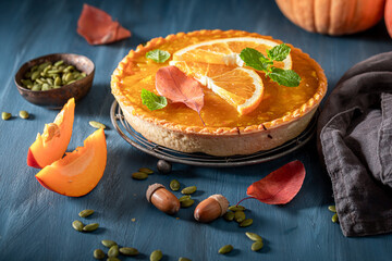 Homemade pumpkin tart made of fruits and cream.