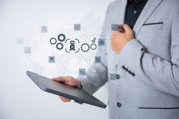 The Business man using AI robots to help analyze and increase efficiency in business