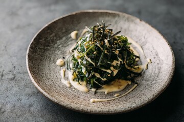 Nori and wakame salad with pickled seaweed and sesame dressing.