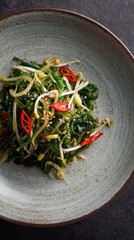 Kombu salad with boiled corn and green onions.