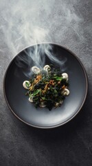 Warm salad with wakame, quinoa, and truffle sauce.