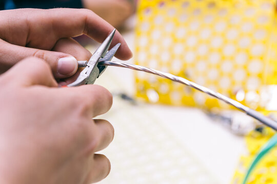 craft time, girl cutting wire with pliers