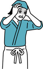 ミスをしてショックを受けている女性の居酒屋店員