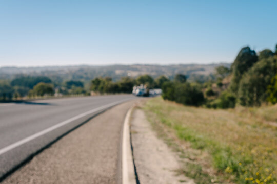 blurry image of a highway with cars approaching