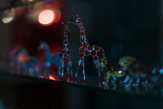 Two ornamental giraffes in the night