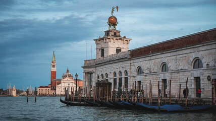 Waterways of Venice at sunset showcasing historic architecture and gondolas