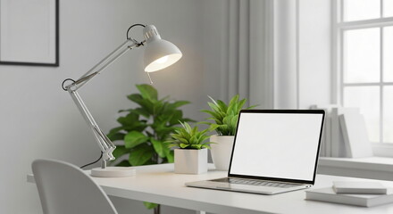Fototapeta premium Laptop with empty white screen on a clean white desk, concept for minimalist home office setup and remote work.