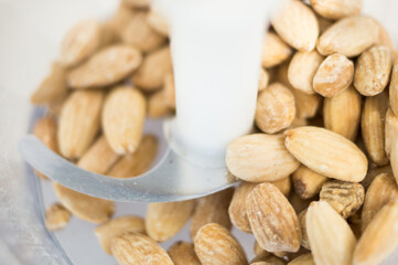 Grinding almonds to make flour for healthy cookies