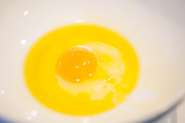 fRaw egg with olive oil as a base for preparing the cookie doug