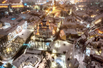 Aerial night View of Tallinn in winter with Alexander Nevsky Cathedral, roofs with snow, Christmas mood
