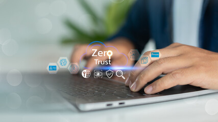 A man using a laptop with a Zero Trust security model is shown on a cloud computing icon....