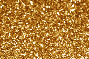 Golden brown bokeh background. New Year, Christmas and all celebration background concept.