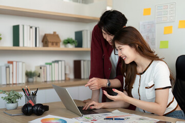 Young Designers Analyzing UX and UI Concepts on Laptop.