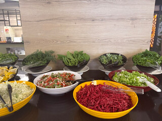  Mediterranean salads with fresh greens served at all-inclusive resort buffet.