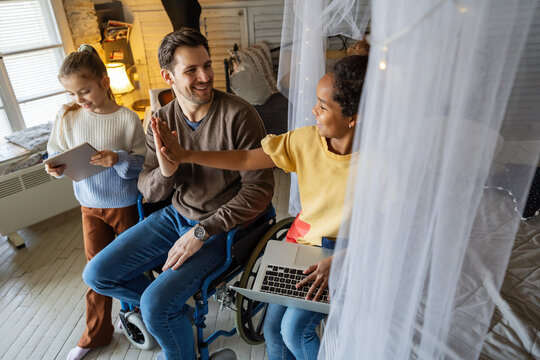 Happy school kids having fun during virtual class with online teacher distance learning at home