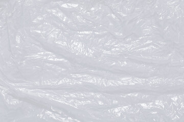 plastic overlay texture of realistic crumpled transparent plastic film wrap on black...