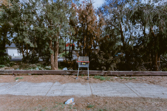 Trolley along street with rubbish