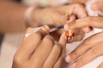 Nail art and beauty treatment at home nail salon with fashion inspired designs creating relaxing...