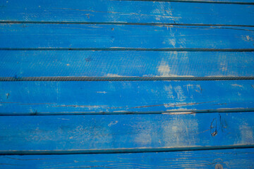 Weathered Blue Wooden Planks with Visible Grain and Texture