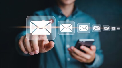 A person interacts with virtual mail icons representing new messages, using a modern mobile device for communication and staying digitally connected.