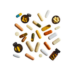 Assortment of Colorful Capsules and Tablets Scattered on Transparent Background