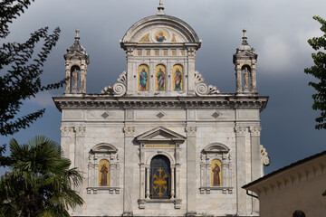 Front View of an Ornate Religious Building with Frescoes and Classical Architecture