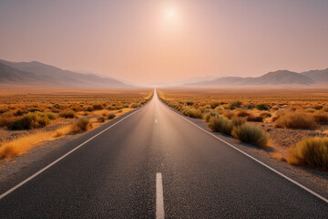 Expansive desert road stretches into the horizon under a warm sunset, surrounded by golden grasses and distant mountains