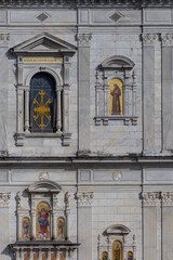Historic Church Facade with Ornate Reliefs and Religious Iconography