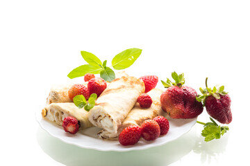 Pancakes with cottage cheese and strawberries on a white background