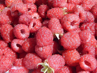 Raspberry background. Fresh ripe raspberries close-up texture