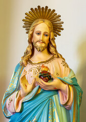 SPELLO, ITALY - MAY 18, 2024: The detail of traditional statue of Heart of Jesus in the church Chiesa di San Severino probably from end of 19. cent. by unknown aritst.